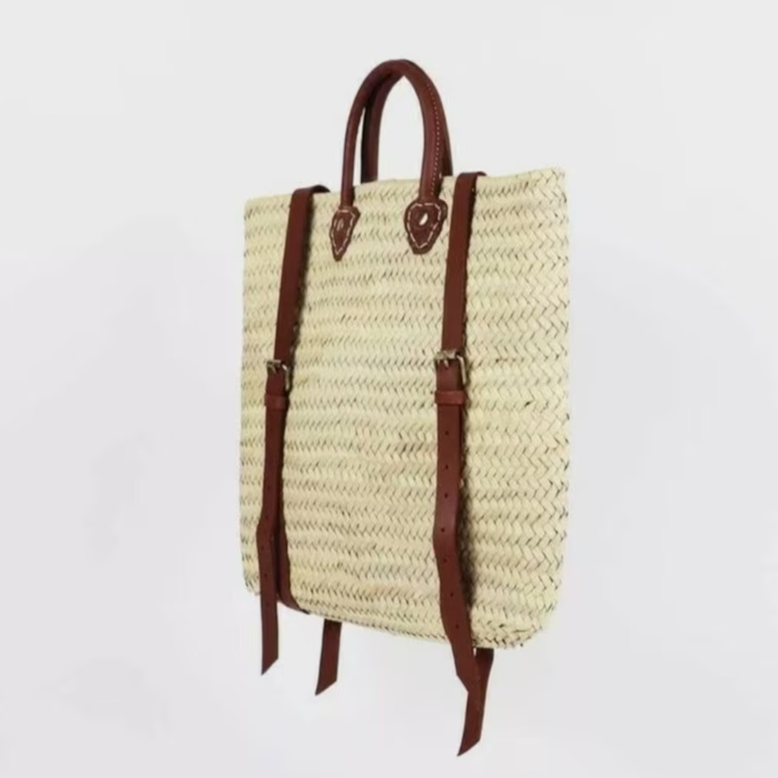 Pale Cream Diagonal Woven Straw Tall Backpack With Rich Brown Stitched Trim, Curved Top Grip And Adjustable Metal Buckle Rear Support Straps